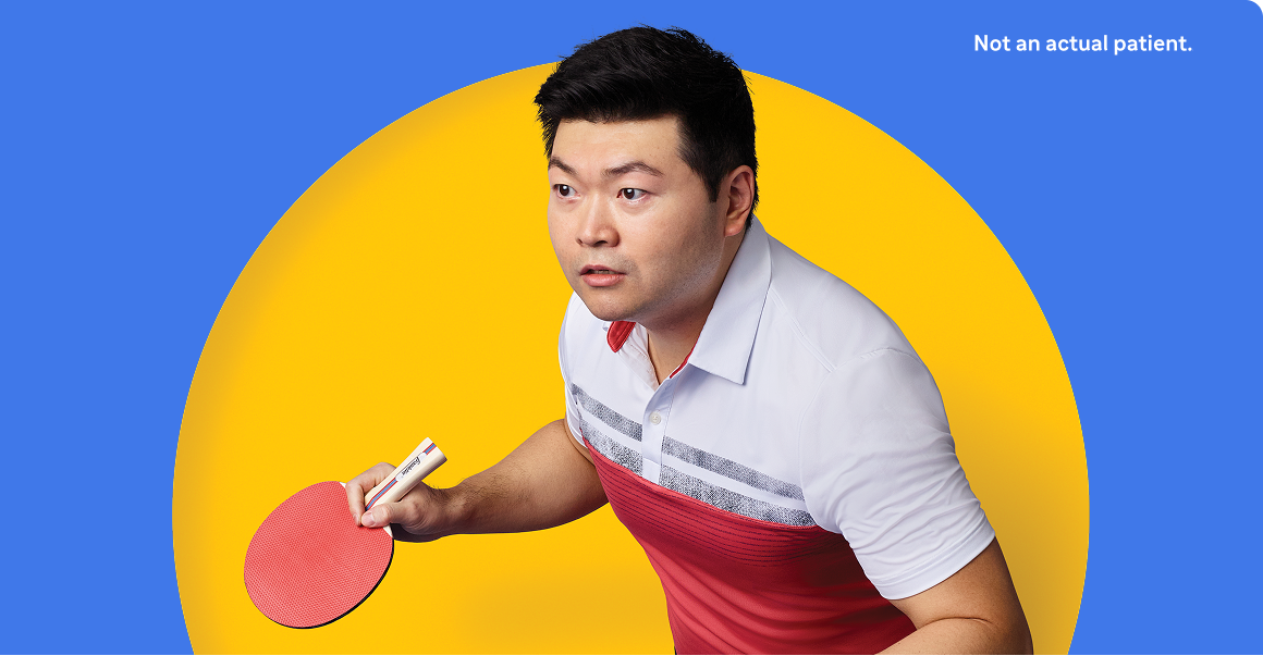 Image of person playing table tennis